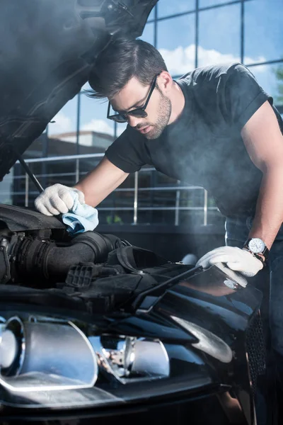 Young Man Working Gloves Trying Repair Engine Broken Car Smoke — стоковое фото
